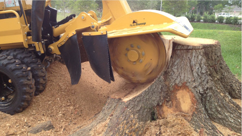 yellow stump grinder in action Crossways